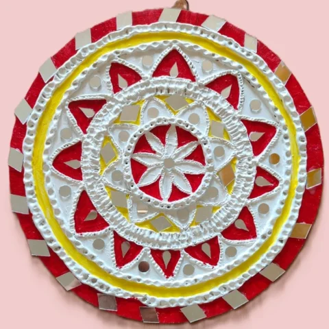 lippan art with red and yellow hues.