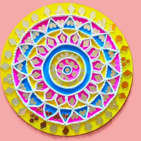 lippan art with yellow, blue, and pink, with mirrors that glow.